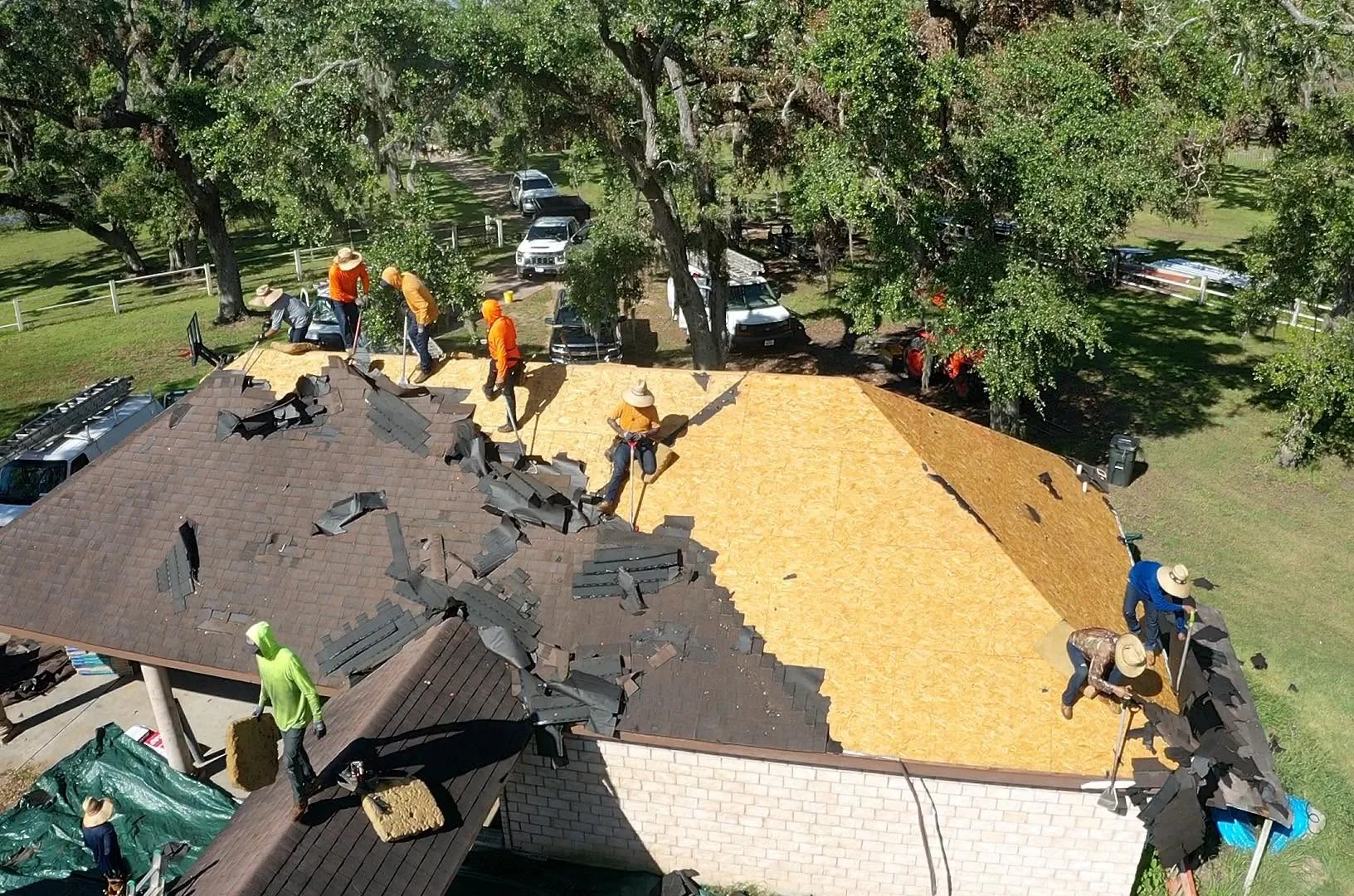 JR Roofing Service crew working on a residential roof